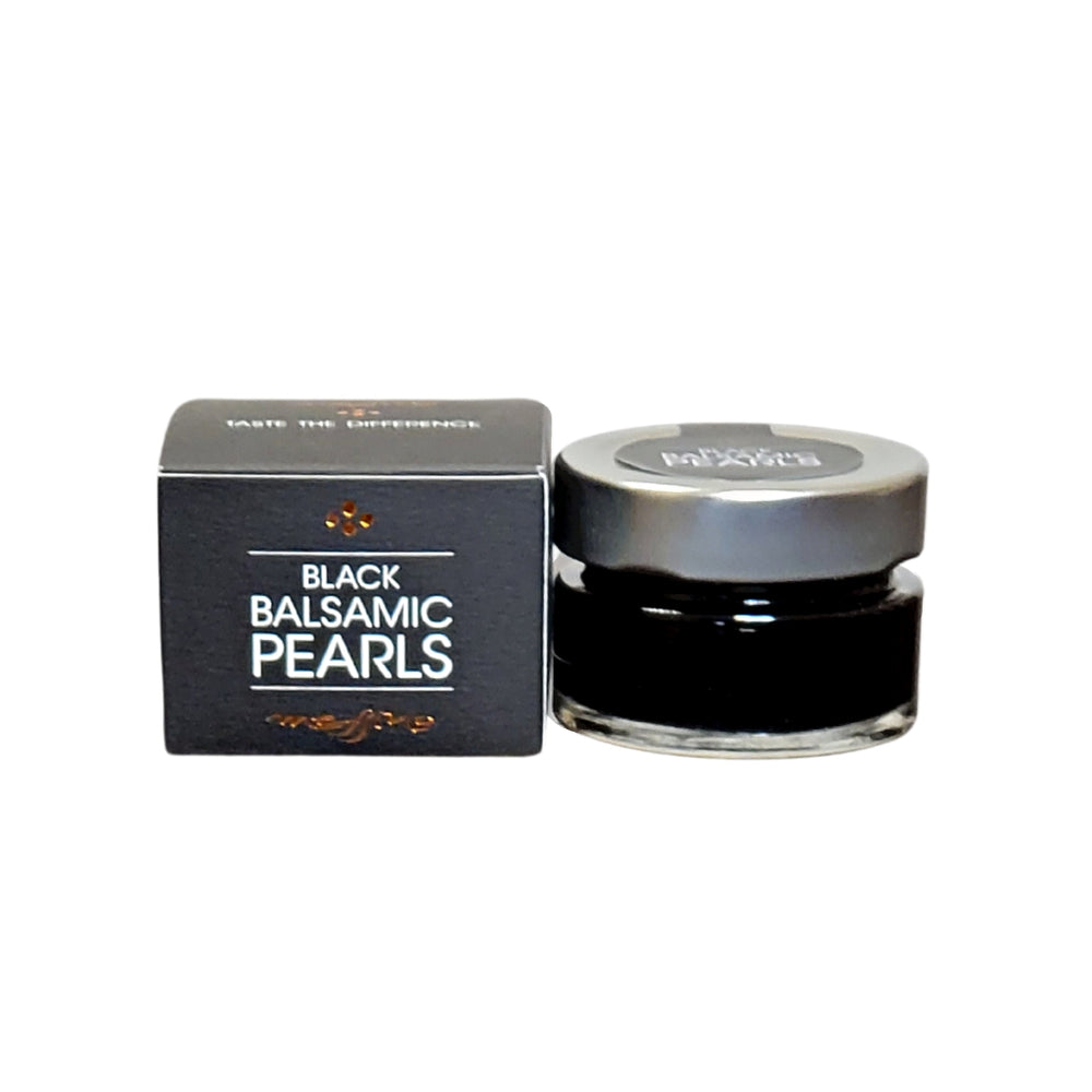 Messino black balsamic pearls are a gourmet molecular gastronomy delight featuring aged balsamic vinegar within a gelatine ball. 